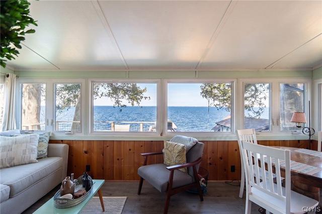 Cottage sunroom with windows onto the lake